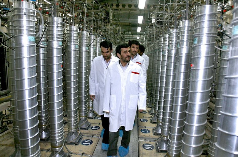 Former Iranian President Mahmoud Ahmadinejad, center, visits the Natanz Uranium Enrichment Facility.