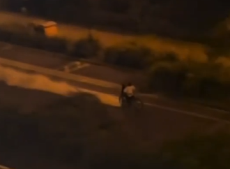 Video shows two people spraying a fire extinguisher from a bike. Police are investigating whether the two incidents are linked.