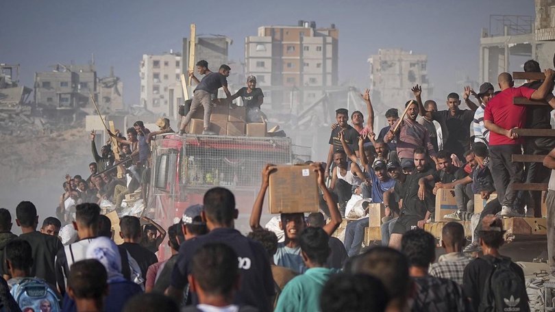 The United Nations agency for Palestinian refugees calls the system for providing aid "a disgrace". (AP PHOTO)