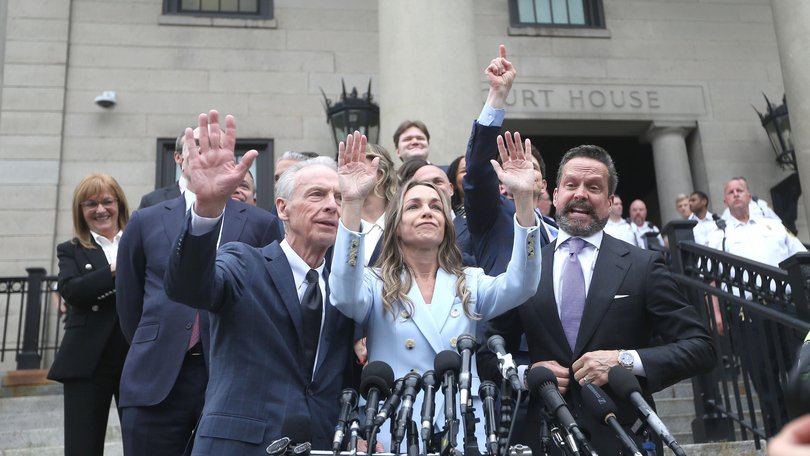 Karen Read greets her supporters after she is acquitted on many of the charges against her.
