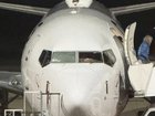 The Qantas passenger jet had its windscreen smashed in.