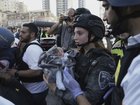 A baby is evacuated from the site of a direct hit from an Iranian missile strike in Ramat Gan, Israel, Thursday, June 19, 2025. 