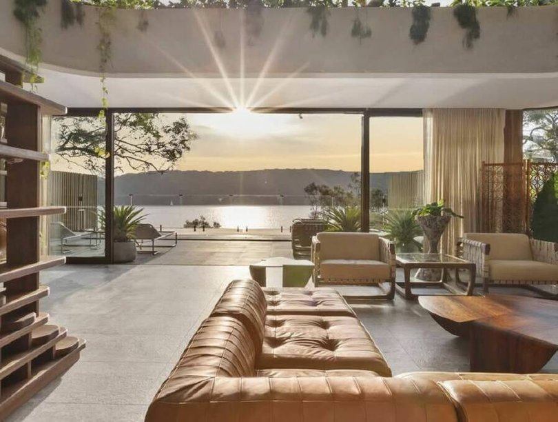 Floor-to-ceiling windows capture the water views from the living room. Picture Instagram