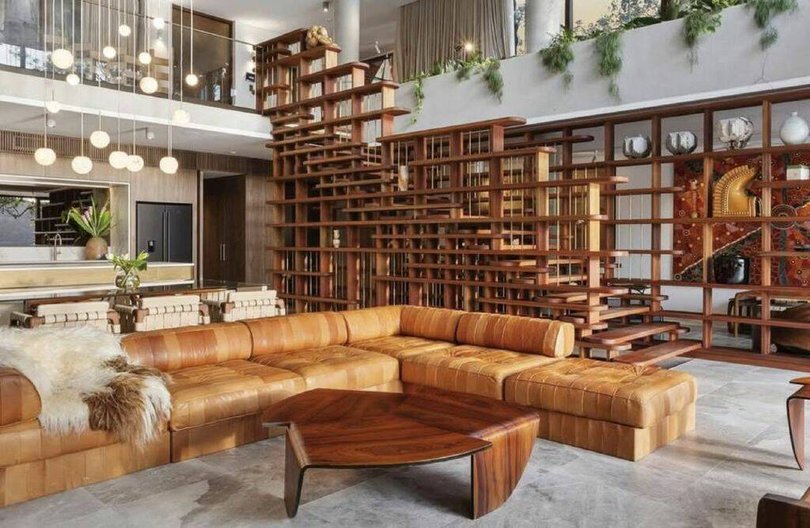 The living room features a spectacular timber staircase. Picture Instagram