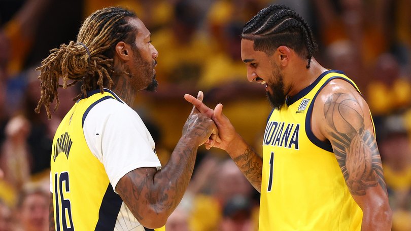 James Johnson and Obi Toppin celebrate during the Pacers’ win.
