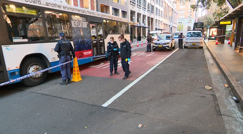A crime scene has been established at the bus stop.