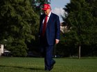 President Donald Trump returns to the White House before a meeting with his National Security Council.