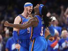 Alex Caruso and Luguentz Dort celebrate during the Game 7 win.