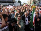 Crowds holding Iranian flags gather in the Revolution Square in the capital Tehran to protest the US attacks on three nuclear facilities in Iran/.