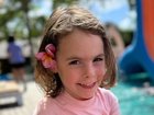 Marigold Jessie, 4, fights for life in an Adelaide hospital after falling from a tree house in Bali.
