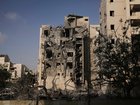 Israeli soldiers and a rescue team search for survivors amid the rubble of residential buildings destroyed by an Iranian missile strike that killed several people, in Beersheba, Israel, on Tuesday, June 24, 2025. (AP Photo/Leo Correa)
