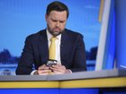Vice President JD Vance checks his phone seconds before his interview with Bret Baier on FOX News.