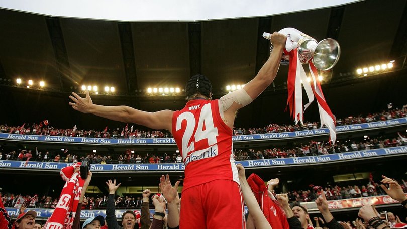 Sydney star Jude Bolton celebrates the 2005 premiership with fans at the MCG.