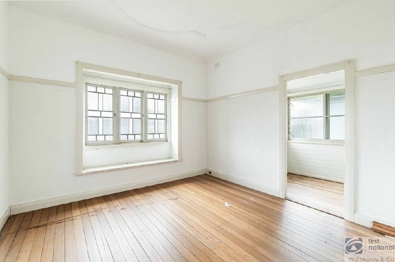 Polished floorboards, decorative ceilings and windows feature in the house located at 16 Simmons Street, North Lismore.