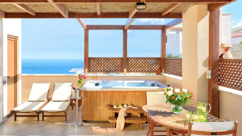 The hillside home has views of the sea.