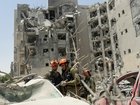 Emergency responders work at a building where four people were killed by an Iranian missile strike in Beersheba, Israel.