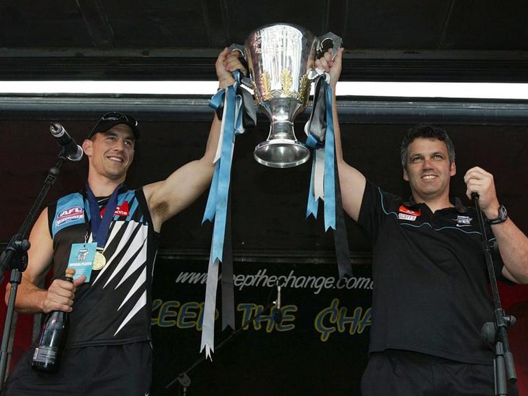 Port Adelaide's Warren Tredrea (left) and coach Mark Williams with the 2004 AFL premiership cup. (Rob Hutchison/AAP PHOTOS)