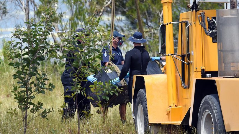 Police divers found the two victims' bodies locked in a metal toolbox submerged in a lagoon.