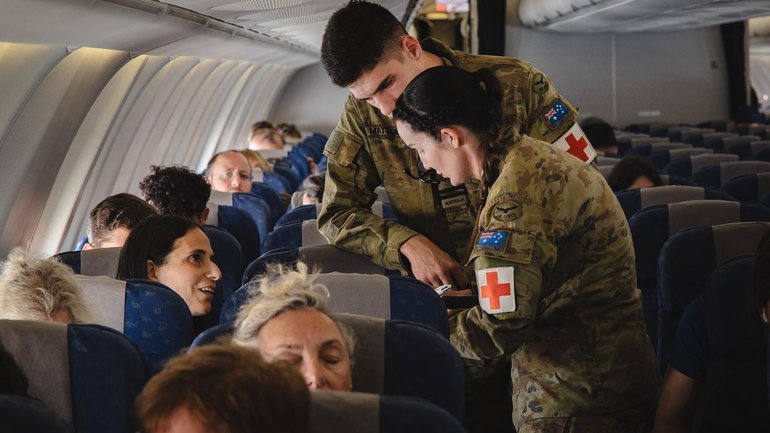 ADF medial personnel check on Australians aboard a RAAF plane out of Tel Aviv this week.