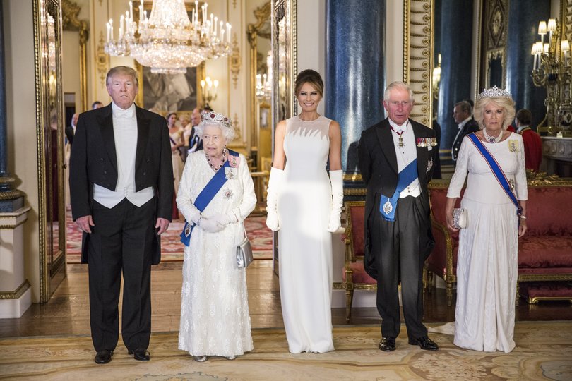President Donald Trump, Queen Elizabeth II, First Lady Melania Trump, then-Prince Charles and Camilla attend a State Banquet at Buckingham Palace in 2019.