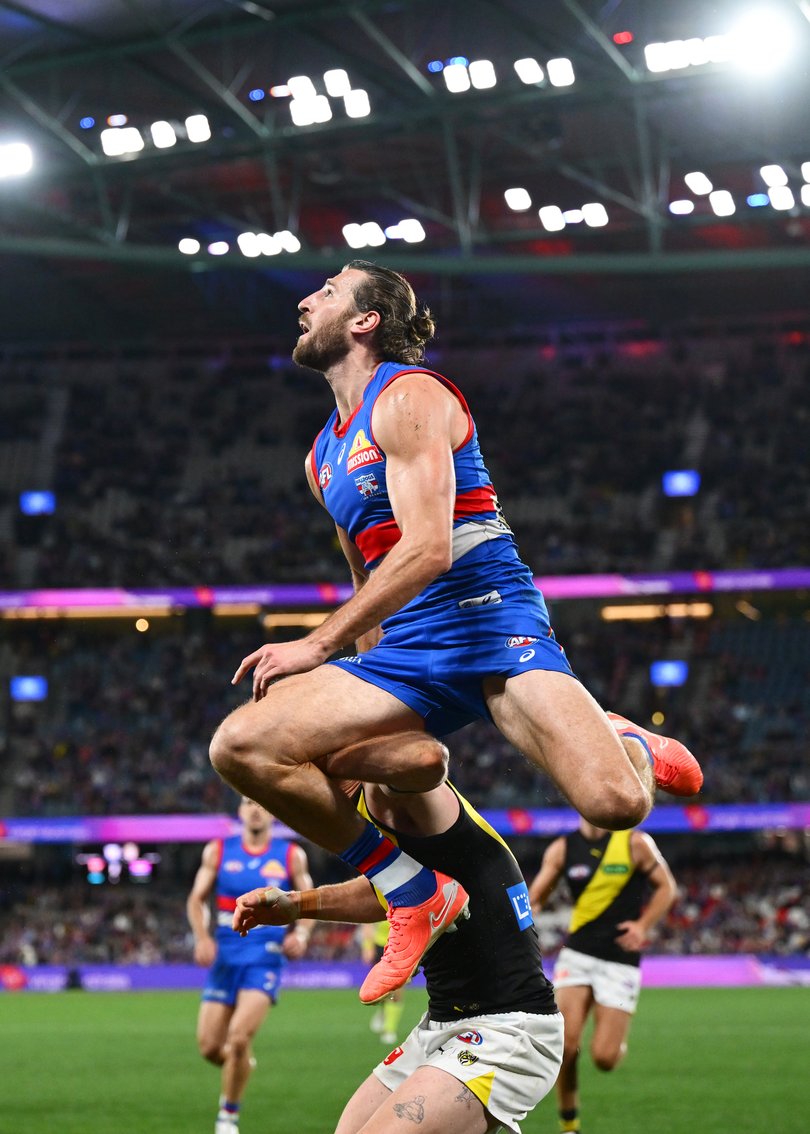 MELBOURNE, AUSTRALIA - JUNE 22: Marcus Bontempelli of the Bulldogs attempts to take a spectacular mark over Nick Vlastuin of the Tigers during the round 15 AFL match between Western Bulldogs and Richmond Tigers at Marvel Stadium, on June 22, 2025, in Melbourne, Australia. (Photo by Quinn Rooney/Getty Images)