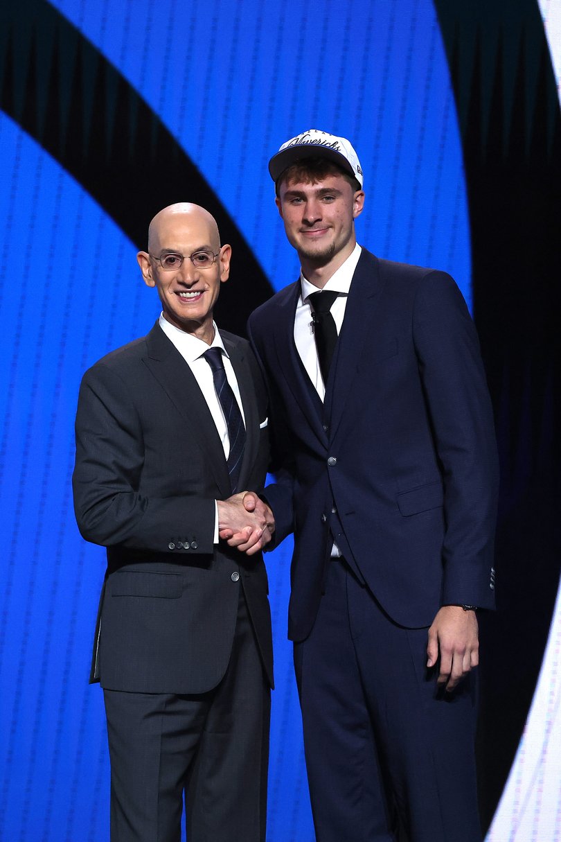Cooper Flagg (shakes hands with NBA commissioner Adam Silver after being drafted first overall by the Dallas Mavericks.