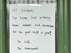 The note plastered on the front of the home. Supplied