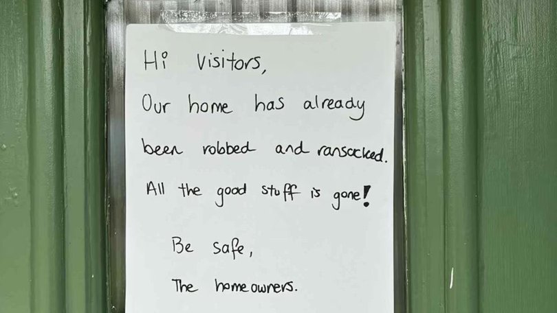 The note plastered on the front of the home. Picture: Supplied