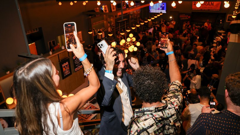 Young Attendees cheer during an election night event with Zohran Mamdani.