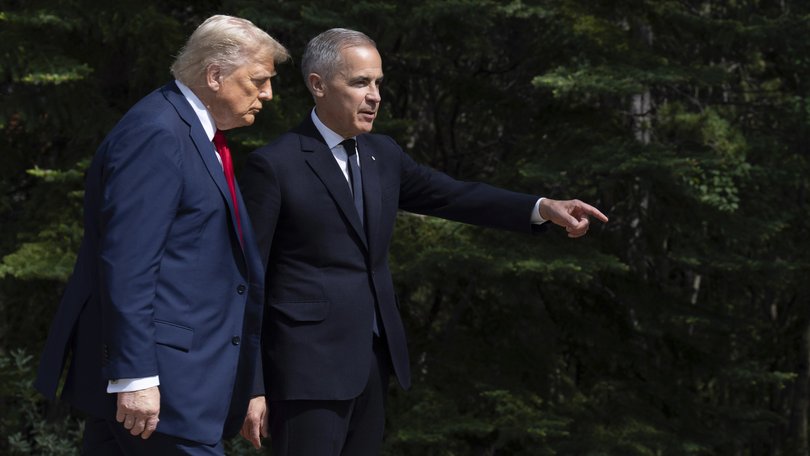 Prime Minister Mark Carney gestures as he speaks with United States President Donald Trump during the official welcome ceremony at the G7 Summit in Kananaskis, Alberta, Canada, Monday, June 16, 2025. (Adrian Wyld/The Canadian Press via AP)