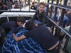 Palestinians children mourn their father, who was killed while heading to an aid distribution hub. (AP PHOTO)
