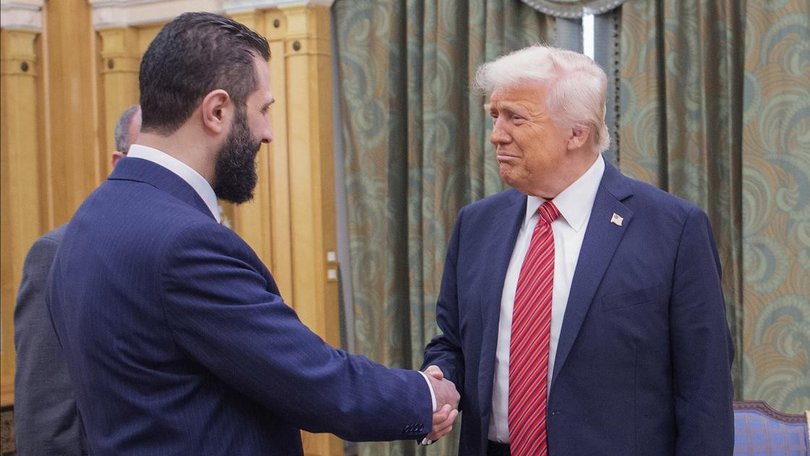Syria's President Ahmed al-Sharaa and Donald Trump discussed lifting US sanctions in May. (AP PHOTO)