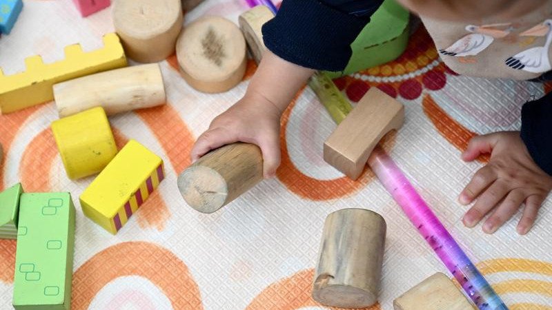 A 26-year-old man from Melbourne who worked at several childcare centres has been charged with dozens of sexual assault offences.