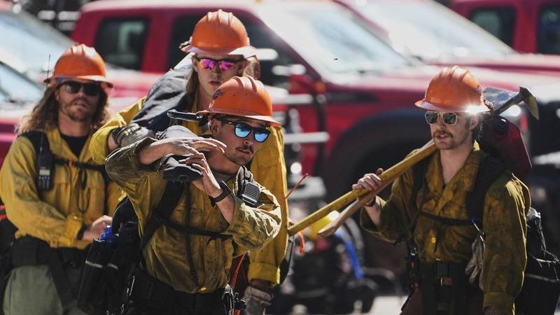 Idaho firefighters are in mourning for two colleagues shot dead at the scene of a wildfire.