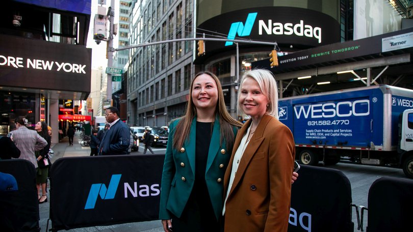 Emilie Choi, president and chief operating officer of Coinbase, left, and Samara Cohen, chief investment officer of ETF and Index Investments for BlackRock Inc, in front of the Nasdaq.