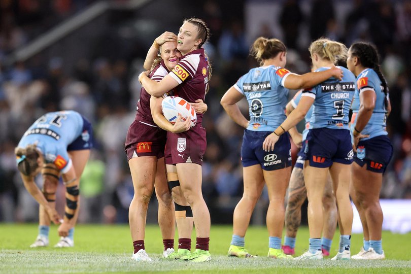 Georgia Hannaway (R) and Emily Bass of the Maroons celebrate winning game three of the Women's State of Origin in May.