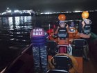Rescuers search for victims after a ferry en route to the resort island of Bali sank off Ketapang, East Java.