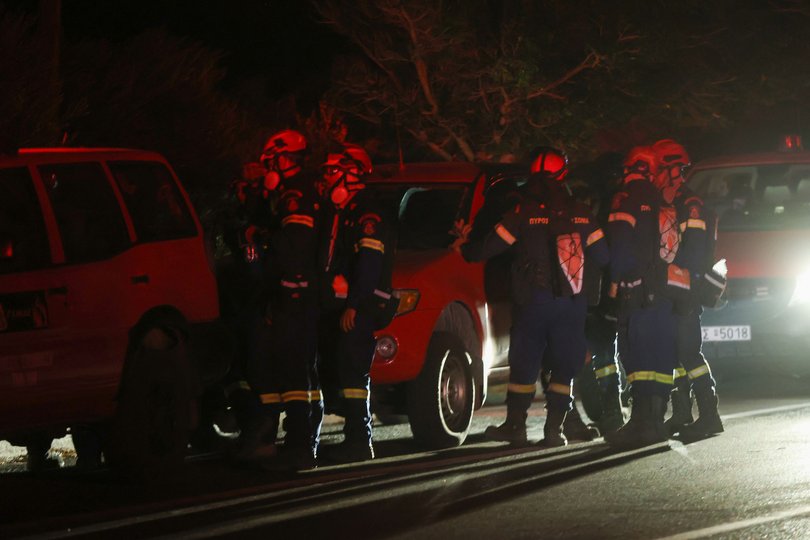Firefighters on the scene of wildfire evacuation operation in Crete.