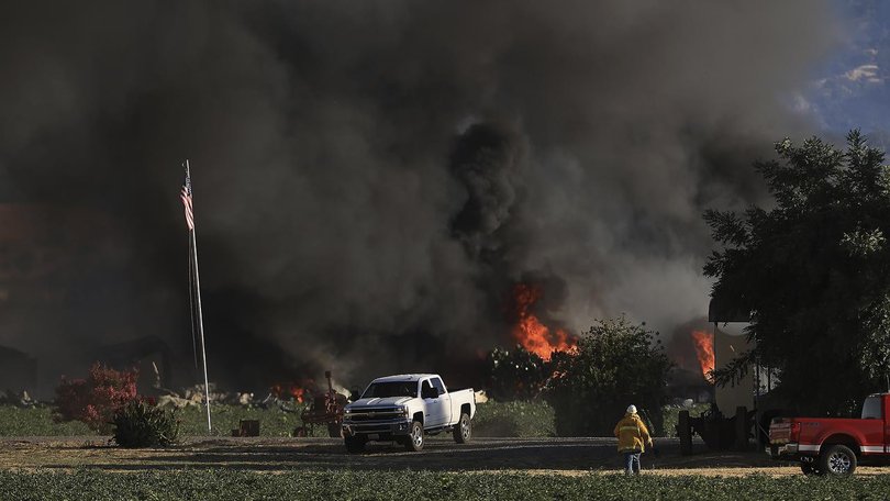 Seven people are missing and two have been injured after a blast set off fireworks in a warehouse. (AP PHOTO)