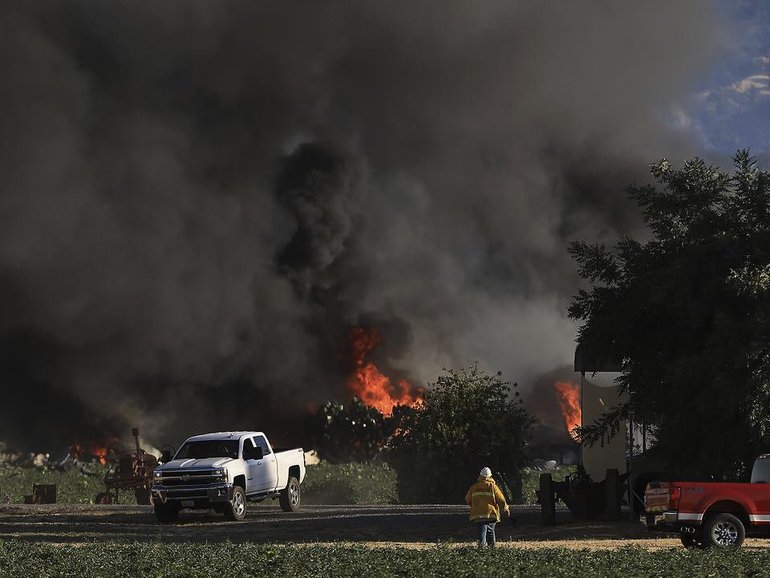Seven people are missing and two have been injured after a blast set off fireworks in a warehouse. (AP PHOTO)