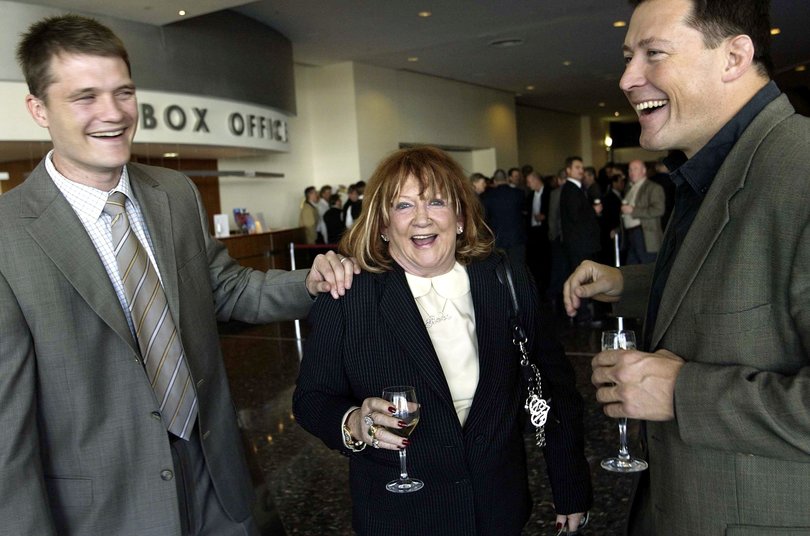 Big Red, aka Eileen Bond, meets former Wallabies greats Ben Tune (left) and Phil Kearns in 2004