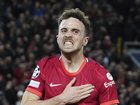 Liverpool's Diogo Jota celebrates after scoring his side's first goal during the Champions League group B soccer match between Liverpool and Atletico Madrid in Liverpool, England, Wednesday, Nov. 3, 2021.(AP Photo/Jon Super)