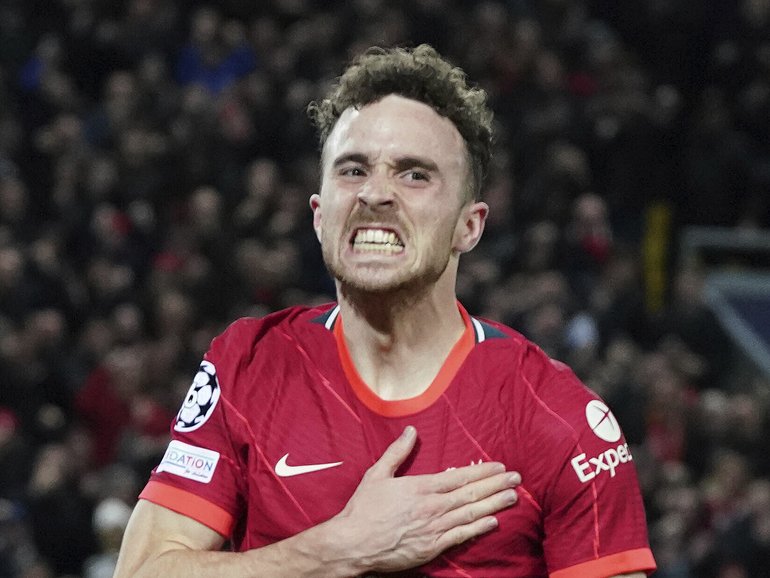 Liverpool's Diogo Jota celebrates after scoring his side's first goal during the Champions League group B soccer match between Liverpool and Atletico Madrid in Liverpool, England, Wednesday, Nov. 3, 2021.(AP Photo/Jon Super)