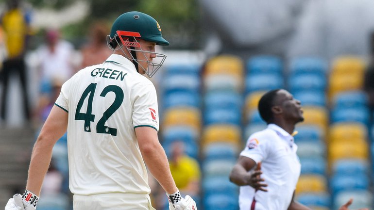 Shamar Joseph (R) of West Indies express disappointment that Cameron Green (L) of Australia was dropped during the first day of the 1st test match between West Indies and Australia at Kensington Oval, Bridgetown, Barbados, on June 25, 2025. (Photo by Randy Brooks / AFP)