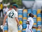 Shamar Joseph (R) of West Indies express disappointment that Cameron Green (L) of Australia was dropped during the first day of the 1st test match between West Indies and Australia at Kensington Oval, Bridgetown, Barbados, on June 25, 2025. (Photo by Randy Brooks / AFP)