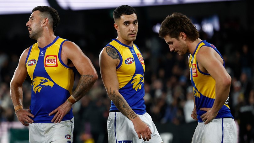 MELBOURNE, AUSTRALIA - JUNE 28: (L-R) Jack Graham, Tyler Brockman and Liam Baker of the Eagles look dejected after a loss during the 2025 AFL Round 16 match between the Collingwood Magpies and the West Coast Eagles at Marvel Stadium on June 28, 2025 in Melbourne, Australia. (Photo by Michael Willson/AFL Photos via Getty Images)