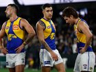 MELBOURNE, AUSTRALIA - JUNE 28: (L-R) Jack Graham, Tyler Brockman and Liam Baker of the Eagles look dejected after a loss during the 2025 AFL Round 16 match between the Collingwood Magpies and the West Coast Eagles at Marvel Stadium on June 28, 2025 in Melbourne, Australia. (Photo by Michael Willson/AFL Photos via Getty Images)