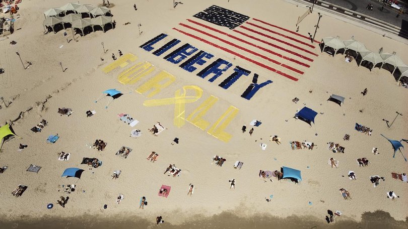 Family and friends of Israelis held captive in Gaza called for their release on US Independence Day. (AP PHOTO)