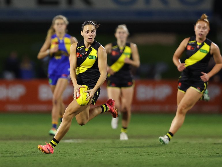 Stars such as Richmond’s Monique Conti are attracting girls to footy.