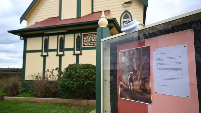 A church notice says Don and Gail Patterson, and Heather Wilkinson are greatly missed. (James Ross/AAP PHOTOS)